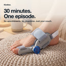 Foot resting on a pouf wearing the Kindtoe Dial